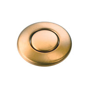 Brushed bronze circular air switch push button with oval center depression on white background.