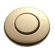 Round French gold air switch button with recessed center and outer rim for sink-mounted installation.