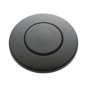 Black circular push button air switch with recessed center button and outer ring.