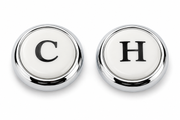 Two round porcelain inserts with chrome rings labeled "C" and "H" for cold and hot water faucet handles.
