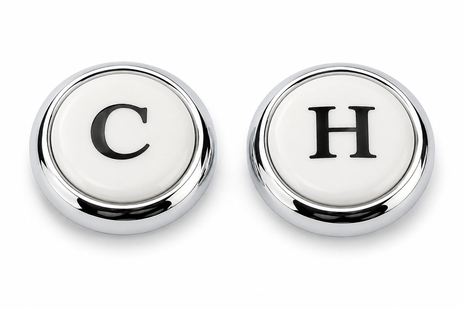 Two round porcelain inserts with chrome rings labeled "C" and "H" for cold and hot water faucet handles.