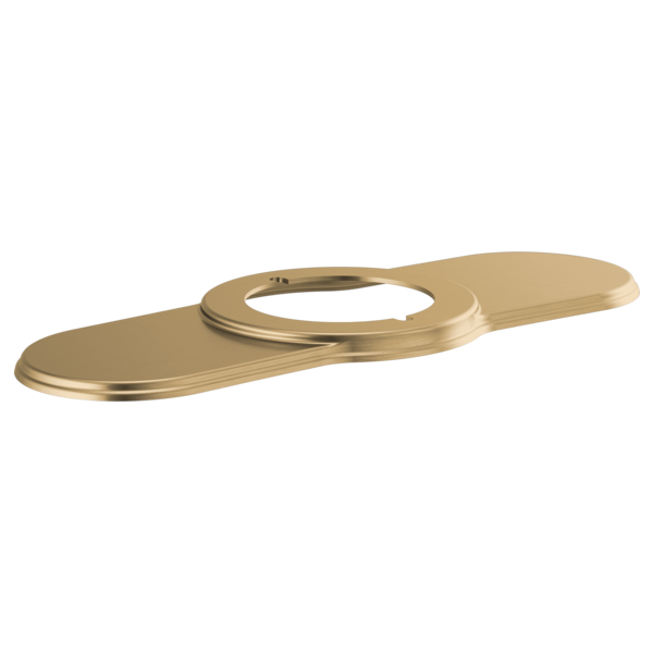 Luxe gold lavatory escutcheon with elongated oval shape and circular opening for faucet installation.