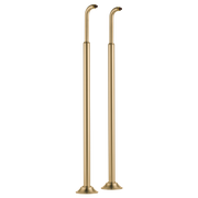 Pair of tall gold metal tub filler risers with curved spouts and circular base feet.