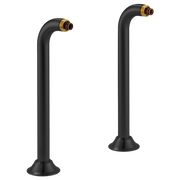Two matte black curved riser extensions with brass fittings at top and round base mounts.