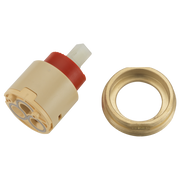 Brass cartridge assembly with cream-colored body, red adjustment stem, and matching brass ring component.