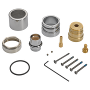 Chrome and brass plumbing components including cylinders, rings, fittings, screws, and a rubber gasket.