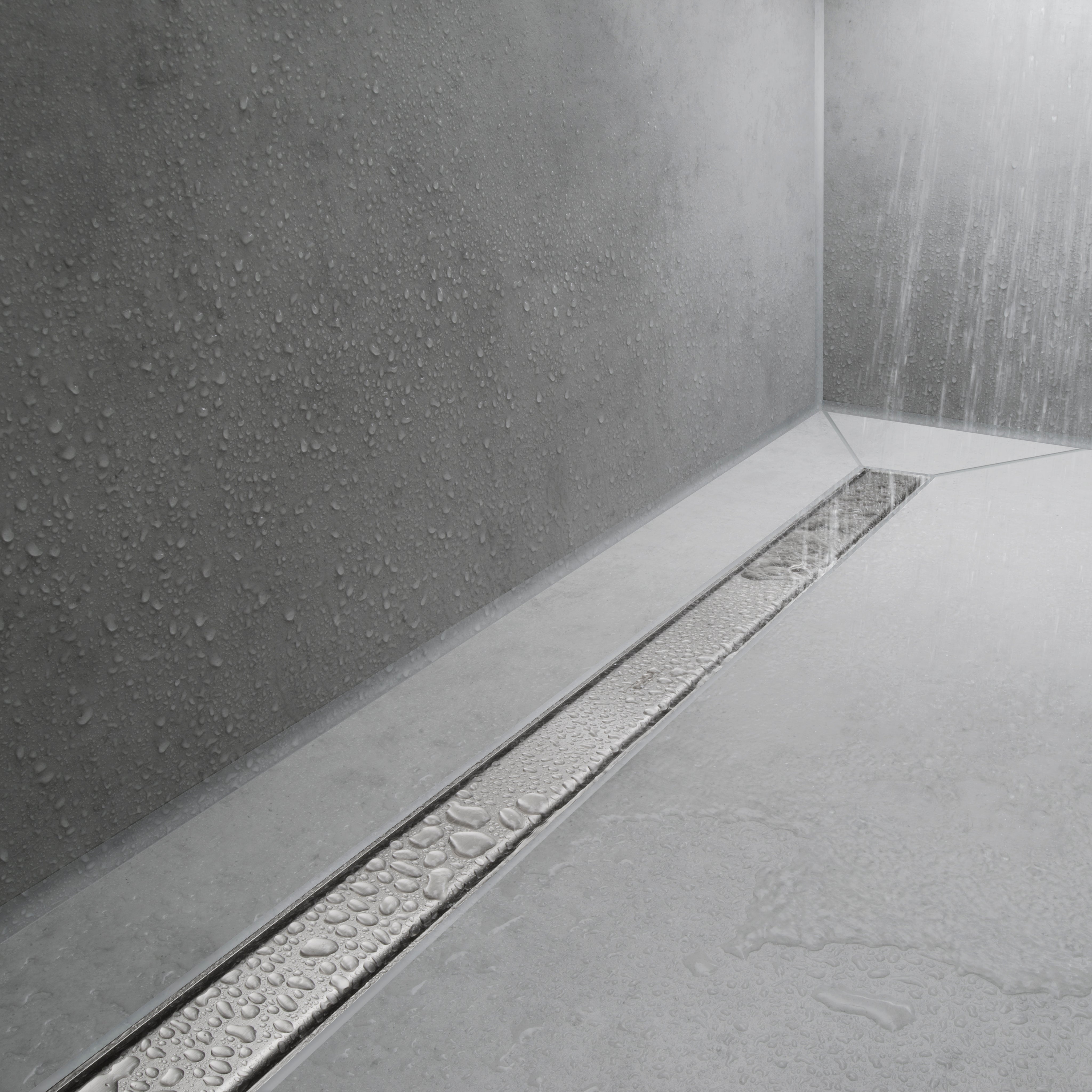 Brushed stainless steel linear floor drain installed in white tile shower with water flowing down textured gray walls.