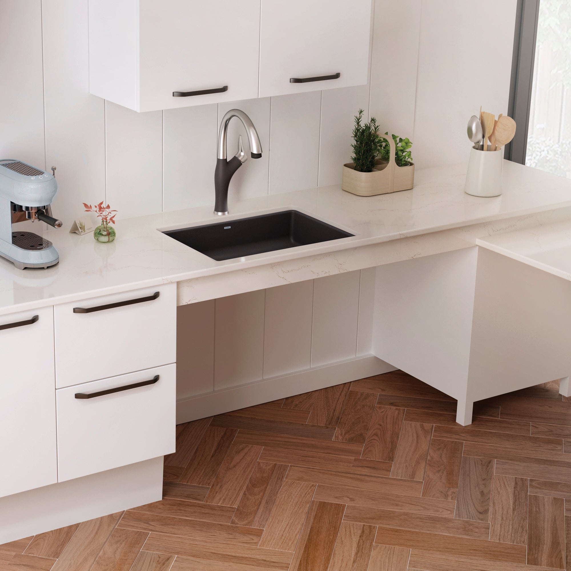 Cinder black rectangular undermount sink installed in white kitchen countertop with pull-down faucet.