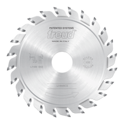 Freud circular saw blade with silver carbide teeth arranged around white center disc, labeled "LI16MBC3" and "Made in Italy."
