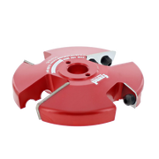 Red Freud router cutter head with four cutting blades and central arbor hole mounted on white background.