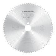 Freud conical scoring saw blade with fine teeth around perimeter, central arbor hole, and "Patented Systems" marking.