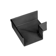 Matte black linear drain component with angled sides and outlet tabs.