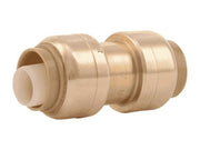 Brass push coupling with white inlet tubes on each end, cylindrical body with grip rings.