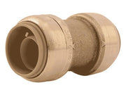 Brass push coupling with 3/4" connectors on both ends, showing open socket on left side.