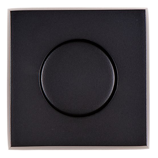Square matte black air switch push button with circular raised center on flat faceplate.