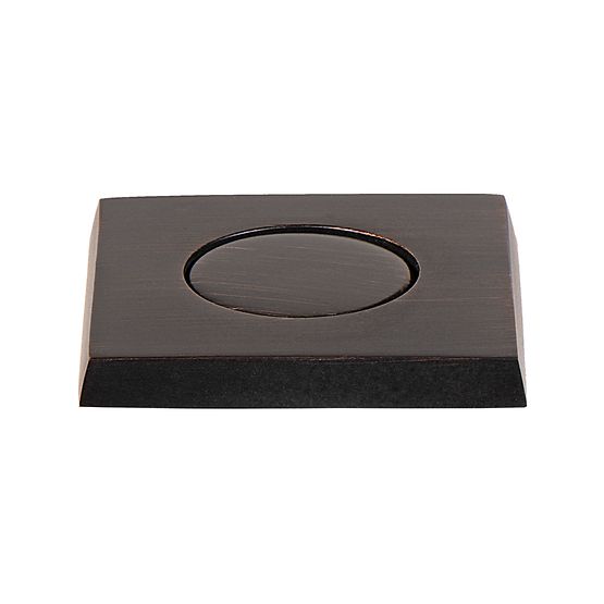 Square oil rubbed bronze air switch button with oval depression and black base, countertop mounted.