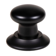 Matte black push button air switch with rounded dome top and circular base.