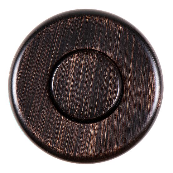 Round oil rubbed bronze air switch button with textured brushed finish and raised circular center.
