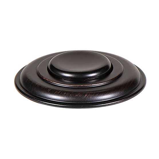 Oil rubbed bronze decorative air switch push button with concentric circular rings and domed center.
