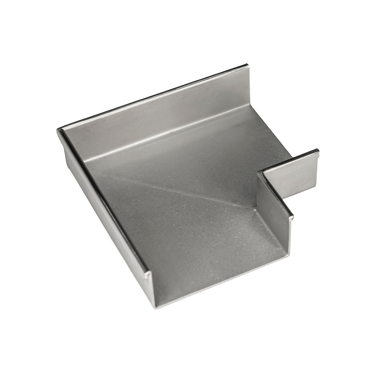 Polished stainless steel linear drain component with rectangular basin and side outlet port.