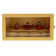 Three red round over and beading router bits with 1/4" shanks in yellow Freud packaging.