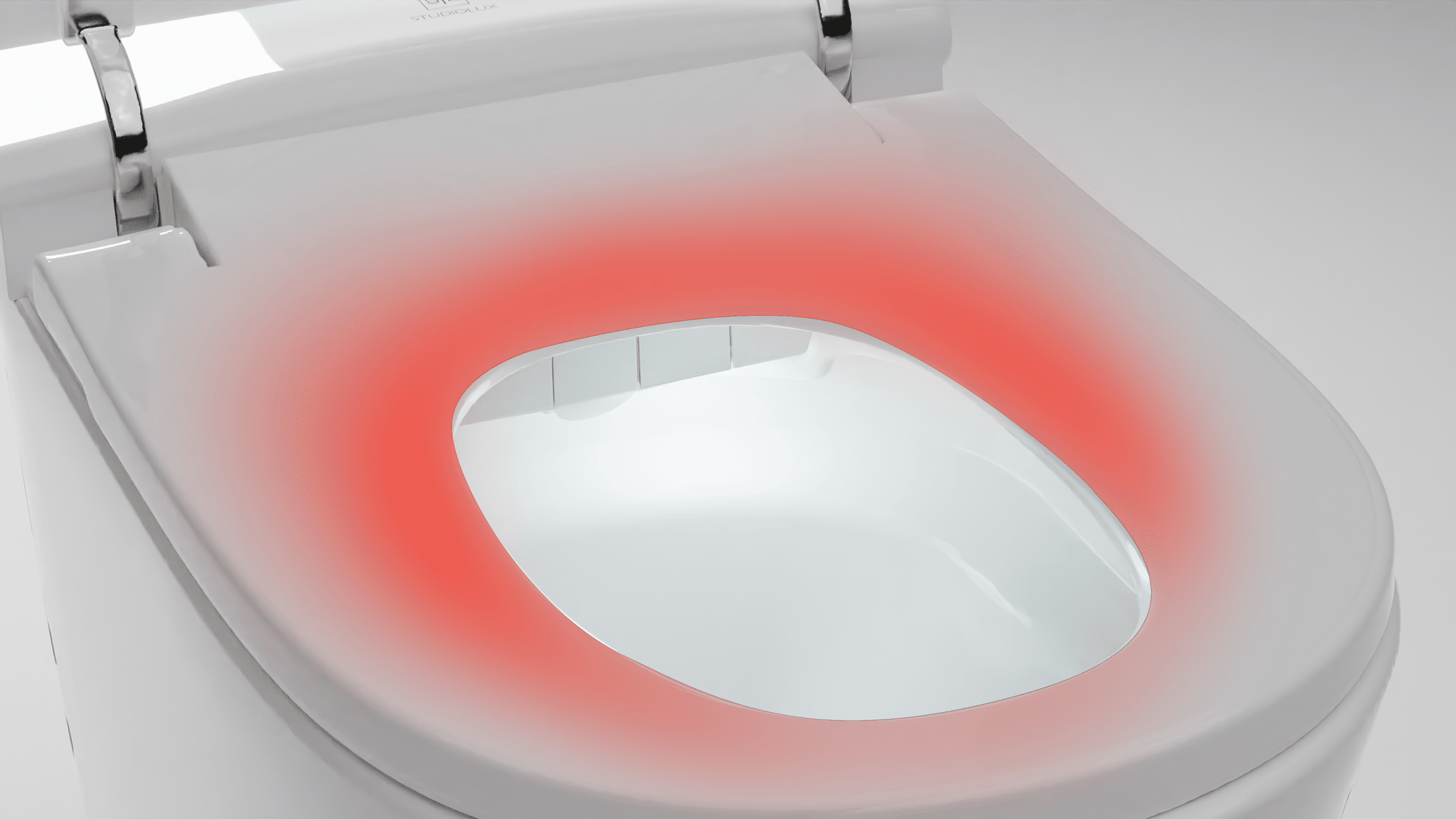 White one-piece tankless toilet with elongated bowl and red illuminated seat ring feature.