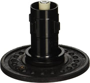 Black cylindrical flushometer repair kit with cream-colored top component and perforated circular base plate.