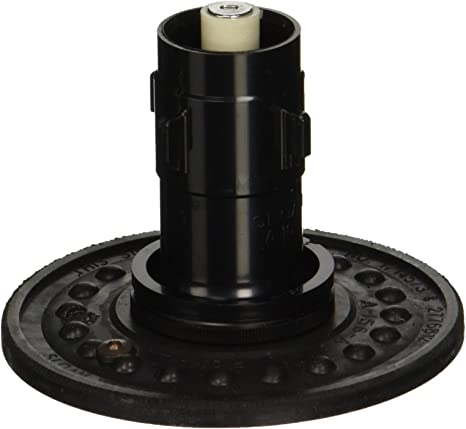 Black cylindrical flushometer repair kit with cream-colored top component and perforated circular base plate.
