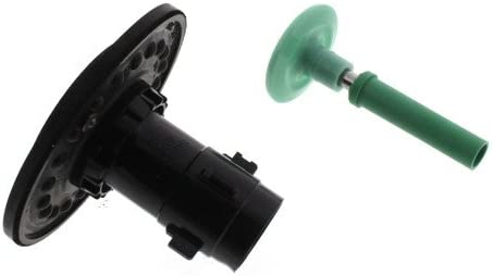 Black cylindrical flushometer valve with metal diaphragm plate and green handle component.