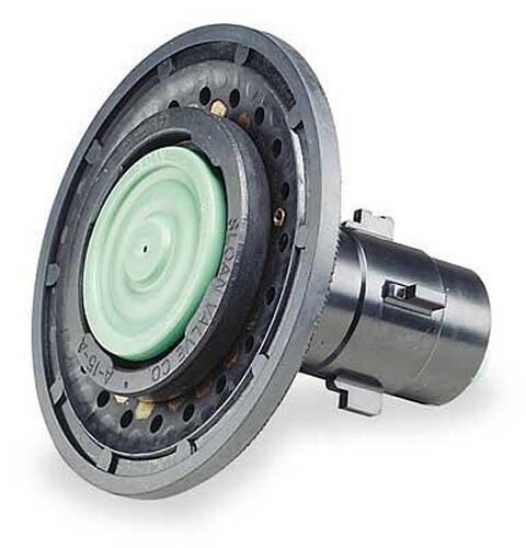 Circular flushometer repair kit with light green diaphragm, black housing ring, and metallic cylindrical valve component.