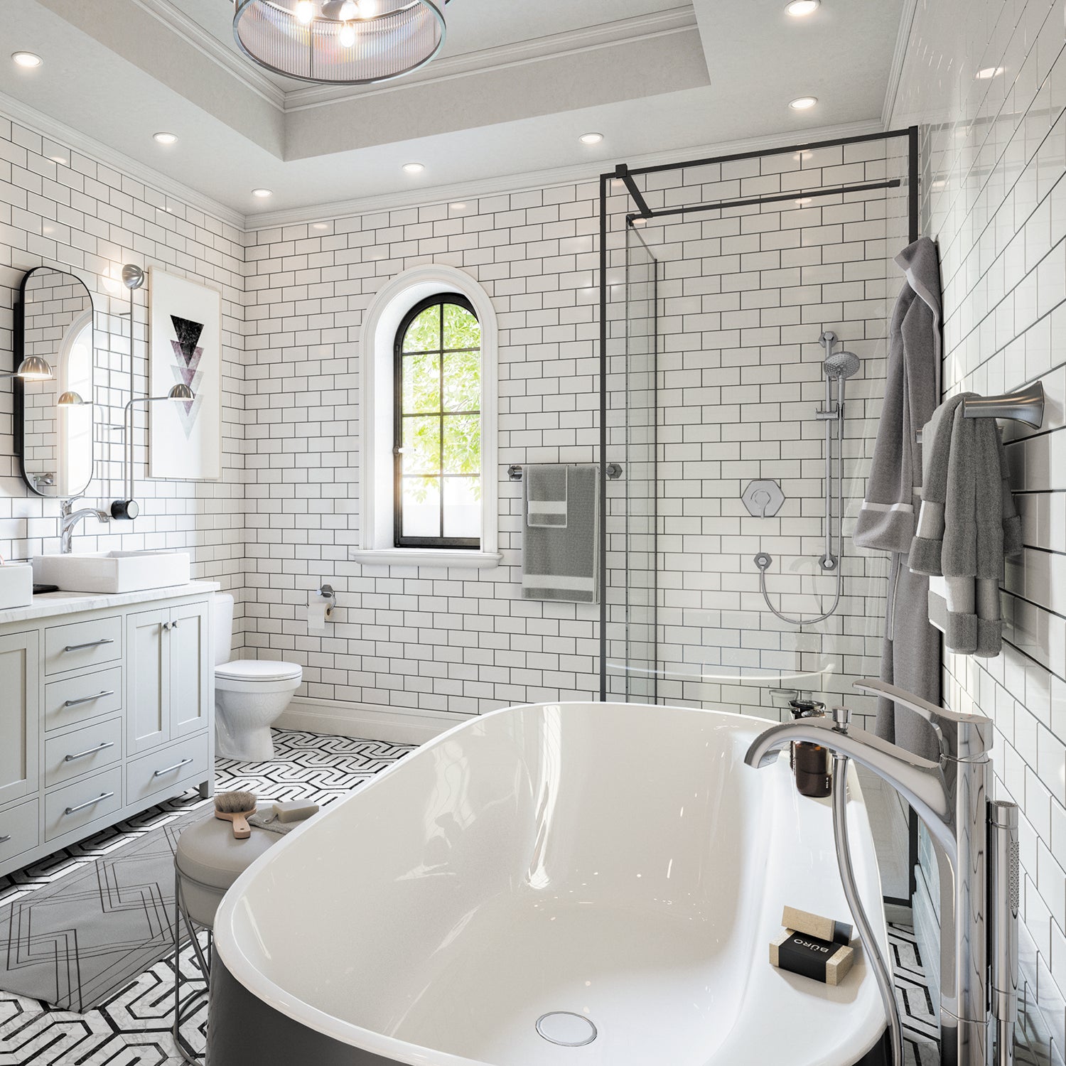 Polished nickel wall-mounted towel bar installed in modern bathroom next to freestanding soaking tub.