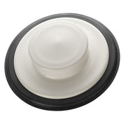 Biscuit-colored sink stopper with black rubber ring and white dome-shaped center piece.
