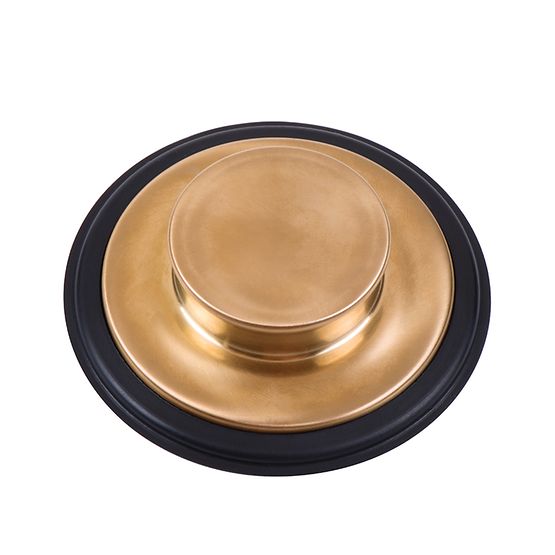 Brushed bronze sink stopper with black rubber rim, viewed from above.