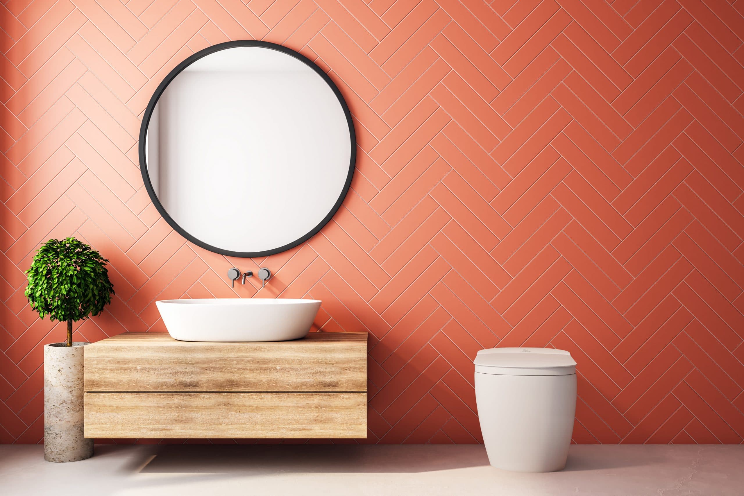 White one-piece tankless toilet with closed lid displayed in bathroom setting next to wooden vanity.