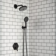 Matte black shower system with overhead rainfall showerhead, wall-mounted arm, handheld showerhead on slide bar, and valve co