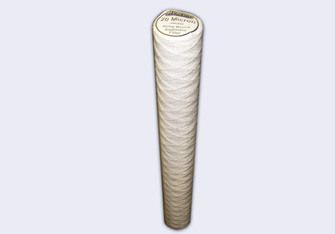 White and tan cylindrical polypropylene string wound sediment filter cartridge with label at top.
