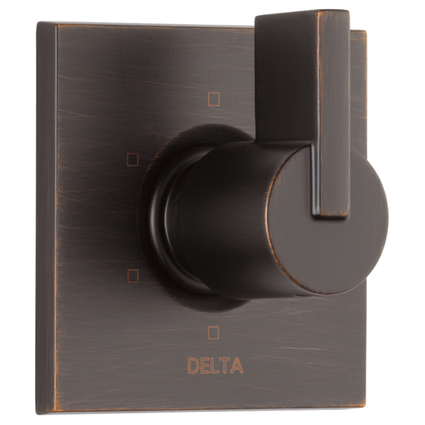 Bronze Delta Vero diverter trim with round handle mounted on square plate with three ports.