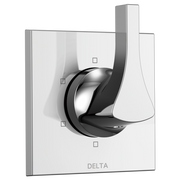 Chrome and matte black diverter trim with curved lever handle mounted on square white escutcheon plate.