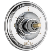 Chrome round trim plate with central valve knob featuring brass accent and setting indicators.