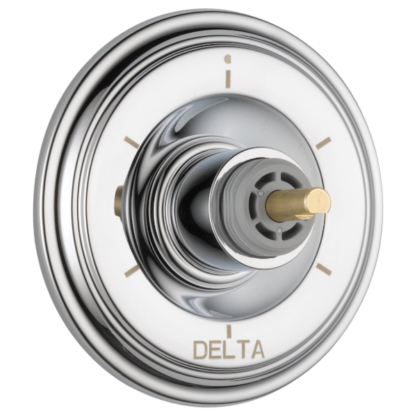 Chrome round trim plate with central valve knob featuring brass accent and setting indicators.