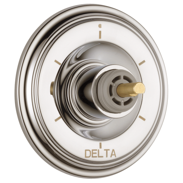 Chrome and brushed gold Delta diverter trim with round escutcheon plate and rotary knob valve control.