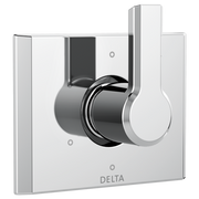 Chrome and white Delta diverter trim with rotatable handle control mounted on square escutcheon plate.