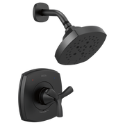 Black Delta Stryke shower system with square wall-mounted trim plate, cross handle, curved arm, and rainfall showerhead with 