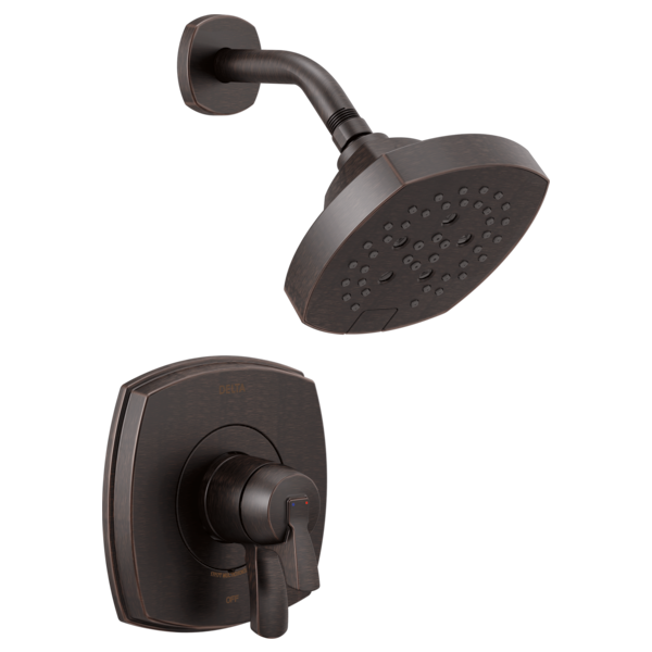 Matte black shower head with perforated face mounted on curved arm and matching wall-mounted valve trim plate with lever hand