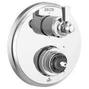 Delta chrome shower valve trim with two handles and diverter control on white oval plate.