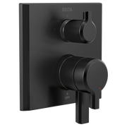 Matte black Delta 17 Series diverter trim with cylindrical handles and integrated control plate for three-function shower ope