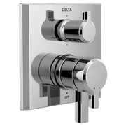 Chrome and gray two-handle shower valve trim with diverter mounted on white rectangular plate.
