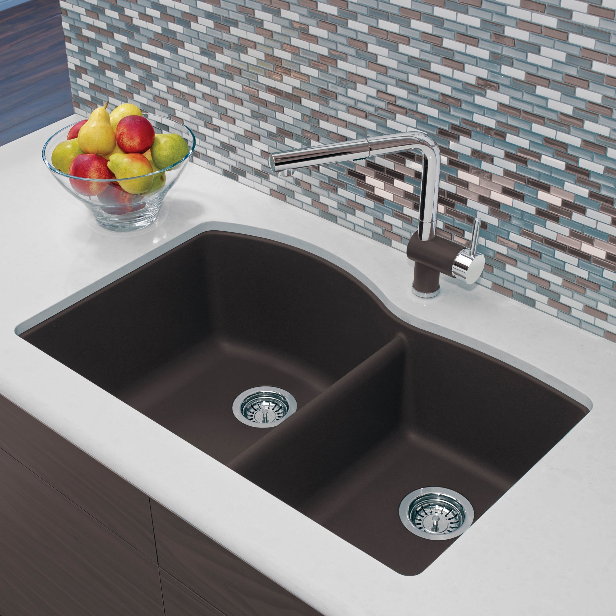 Cafe brown double-bowl undermount kitchen sink with chrome faucet installed in white countertop.