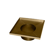 Satin bronze square drain with center opening and threaded connection port below.