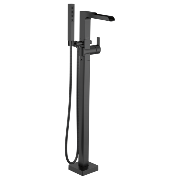 Black floor-mounted tub filler with single handle, channel spout, and detachable hand shower on hose.